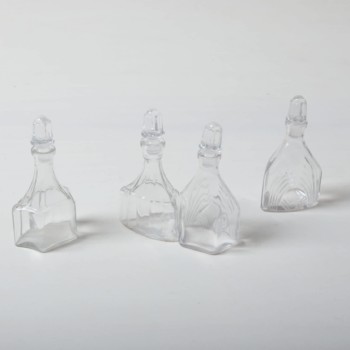 Crystal Glass Bottles Abital | In the past, vinegar and oil were served in these romantic crystal carafes. In their new lives these small flasks still look great on the table; they now serve as vases for meadow flowers and elegant grass leaves. It doesn't matter if placed individually or in groups.The crystal bottles go very well with our larger crystal carafes and bowls | gotvintage Rental & Event Design