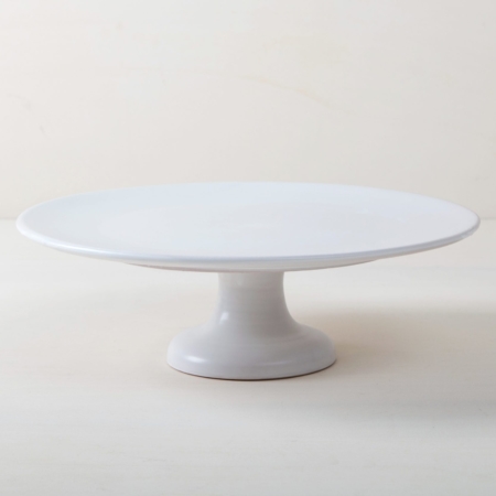 Cake Stand Ernesta Matt White XL | Our large round elevated cake stand Ernesta rests on a 15 cm high foot and has a diameter of 40 cm. Enough space to present and serve cakes, cupcakes, sushi and other delicious food on the table or at the modern buffet. The serving trays are handcrafted from high-quality terracotta and glazed matt white, of course food safe.These cake stands are available in three different sizes as well as a matt black serving plate. They can be wonderfully combined for presentations. | gotvintage Rental & Event Design