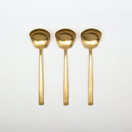 Sauce Spoon Ines Cutlery Gold Matt | With the cutlery series Ines we rent out wonderful, matt-gold stainless steel cutlery. The cutlery has a wonderful haptic and looks equally good for different types of events. Whether on a colourful table setting combined with strong colours, an elegant, minimalistic wedding or a stylish business dinner - our matt gold cutlery Ines is an excellent choice for your event.Hire the sauce spoons Ines, in addition to the golden cutlery, to thrill your guests.Matching the matt golden sauce spoons Ines we also offer vintage tableware and vintage serving bowls for rent. | gotvintage Rental & Event Design